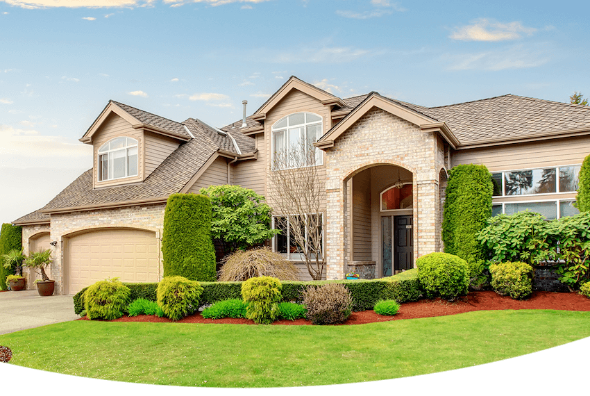 tan brick home with green front yard